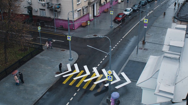 Video Reference: Building, Window, Infrastructure, Road surface, Zebra crossing, Asphalt, Car, Urban design, Thoroughfare, Motor vehicle