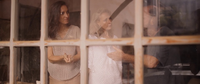 Video Reference: Hairstyle, Window, Shoulder, Facial expression, Bridal clothing, Wedding dress, Textile, Bridal veil, Happy, Dress