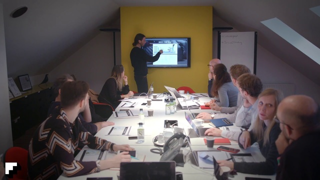 Video Reference: Table, Conference room table, Computer, Desk, Laptop, Communication Device, Suit, Chair, Service, White-collar worker