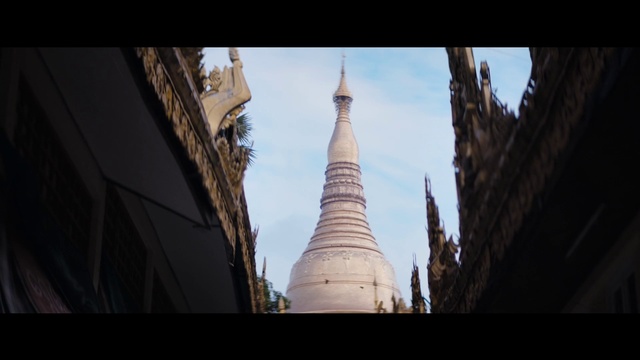 Video Reference: Sky, Cloud, Building, Tints and shades, Cone, Tree, Stupa, Symmetry, Finial, City
