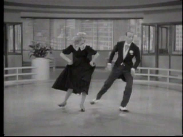 Video Reference: Gesture, Dress, Style, Black-and-white, Plant, Performing arts, Tints and shades, Flooring, Entertainment, Event