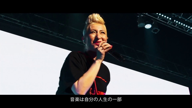 Video Reference: Smile, Microphone, Flash photography, Gesture, Music artist, Music, Entertainment, Audio equipment, Performing arts, Font