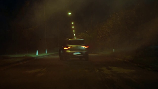 Video Reference: Car, Vehicle, Automotive lighting, Headlamp, Tire, Asphalt, Tints and shades, Road, Midnight, Automotive design