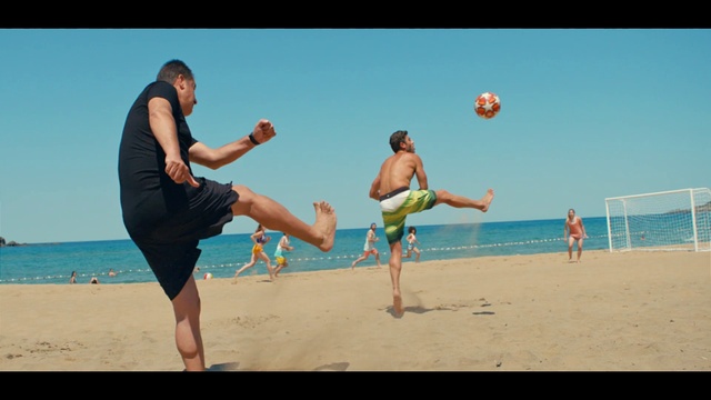 Video Reference: Sky, Shorts, Water, Sports equipment, People on beach, Beach, Trunks, Ball, Gesture, Net sports
