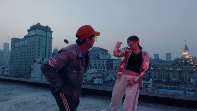 Video Reference: Sky, Outerwear, Cap, Baseball cap, Travel, Gesture, Pink, Eyewear, Magenta, Fun