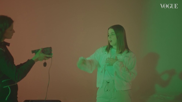 Video Reference: Gesture, Microphone, Entertainment, Audio equipment, Visual effect lighting, Plastic bottle, Public speaking, Electronic device, Event, Fun