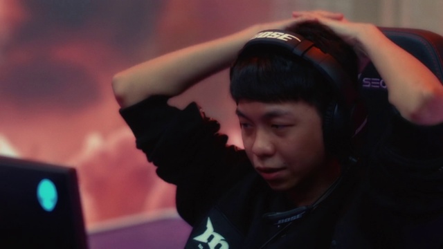 Video Reference: Flash photography, Gesture, Audio equipment, Black hair, Hearing, Gadget, Happy, Jacket, T-shirt, Fun