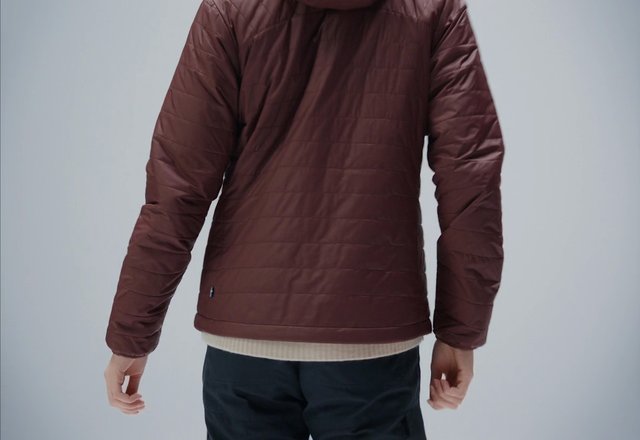 Video Reference: person, back view, jacket, quilted jacket, maroon, outerwear, fashion, clothing, studio, plain background, casual wear, sweater, dark pants, rear view, apparel