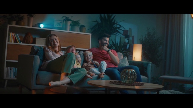Video Reference: Furniture, Table, Couch, Comfort, Living room, Entertainment, Coffee table, Houseplant, Space, Event