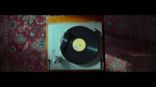 Video Reference: turntable, vinyl, record, music, audio, retro, top-down, carpet, interior, analog, nostalgia, still life