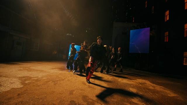 Video Reference: Entertainment, Road surface, Midnight, Road, Event, Darkness, Electric blue, Performing arts, Fun, Pedestrian