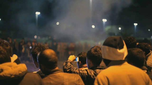 Video Reference: Sky, Hat, Crowd, Cloud, City, Event, Entertainment, Midnight, Darkness, Public event