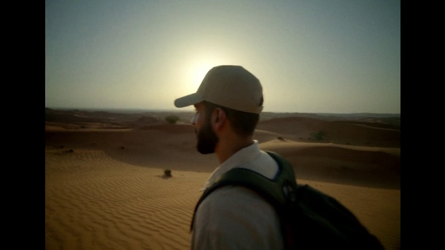 Video Reference: Sky, Travel, Headgear, Erg, Morning, Horizon, Landscape, Aeolian landform, Cap, Singing sand