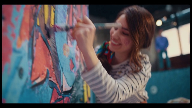 Video Reference: Facial expression, Smile, Gesture, Finger, Street fashion, People, Artist, Art, Electric blue, T-shirt