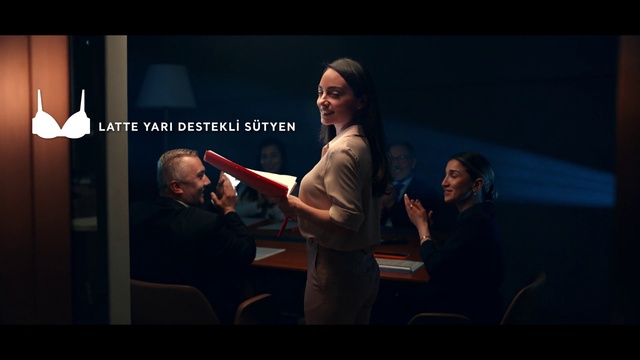 Video Reference: Coat, Gesture, Flash photography, Entertainment, Suit, Event, Performing arts, Public speaking, Chair, Job