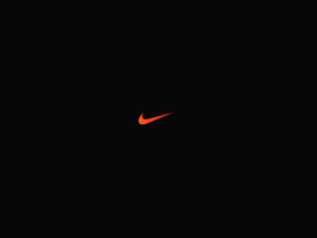 Video Reference: black background, logo, swoosh, orange, minimal, brand mark, centered, dark, simple, clean