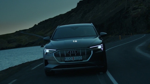 Video Reference: Vehicle registration plate, Car, Vehicle, Sky, Grille, Automotive lighting, Hood, Mountain, Automotive design, Motor vehicle