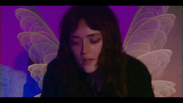 Video Reference: Forehead, Nose, Hairstyle, Eyebrow, Mouth, Purple, Eyelash, Jaw, Flash photography, Organism