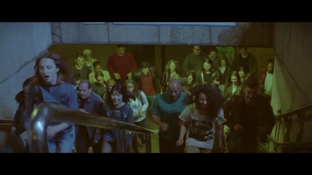 Video Reference: Art, Font, T-shirt, Entertainment, Leisure, Event, Fun, Visual arts, Crowd, Team