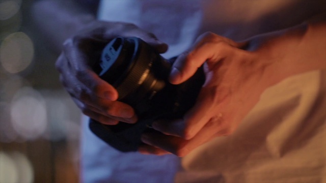 Video Reference: Hand, Drinkware, Fluid, Finger, Gesture, Cameras & optics, Camera lens, Cup, Drink, Wood