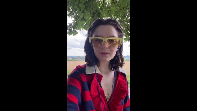 Video Reference: Lip, Hairstyle, Vision care, Facial expression, Flash photography, Goggles, Neck, Sleeve, Eyewear, Tartan