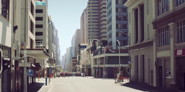 Video Reference: Building, Daytime, Window, Sky, Infrastructure, Road surface, Skyscraper, Urban design, Neighbourhood, Biome