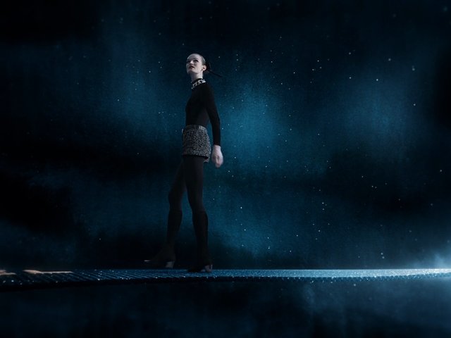 Video Reference: fashion, model, runway, catwalk, editorial, dark background, blue lighting, studio, glamour, full body, silhouette, stage, high fashion, performance, dramatic, abstract