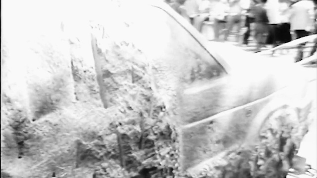 Video Reference: Hood, Automotive tire, Motor vehicle, Black-and-white, Style, Vehicle door, Grass, Freezing, Geological phenomenon, Automotive exterior