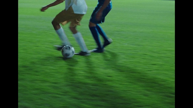 Video Reference: Shoe, Sports equipment, Soccer, Football, Green, Ball, Grass, Player, Shorts, Sneakers