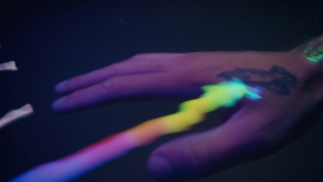 Video Reference: Arm, Human body, Purple, Gesture, Violet, Entertainment, Thumb, Elbow, Nail, Wrist