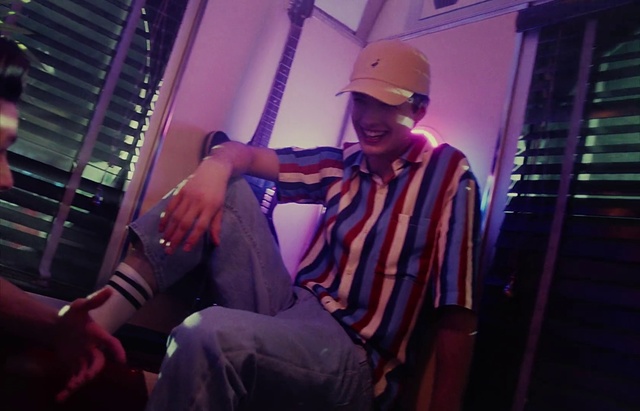 Video Reference: Purple, Flash photography, Cap, Entertainment, Pink, Hat, Performing arts, Magenta, Baseball cap, Artist