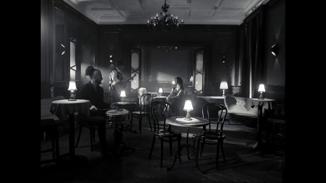 Video Reference: Furniture, Chair, Couch, Black-and-white, Flash photography, Entertainment, Style, Building, Suit, Table