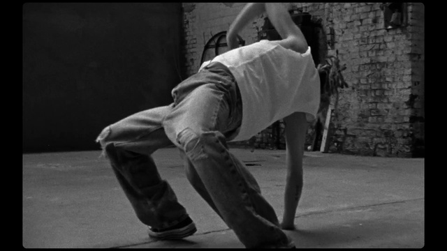 Video Reference: Leg, Flash photography, Grey, Knee, Elbow, Black-and-white, Entertainment, Performing arts, Human leg, Dance