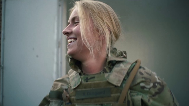 Video Reference: Smile, Camouflage, Military camouflage, Human body, Jaw, Gesture, Marines, Military person, Military uniform, Non-commissioned officer