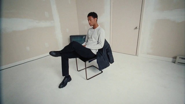 Video Reference: Comfort, Chair, Flooring, Floor, Automotive design, Art, White-collar worker, Event, Sitting, Room