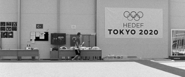 Video Reference: Black, Black-and-white, Desk, Font, Table, Chair, Audio equipment, Monochrome photography, Monochrome, Event