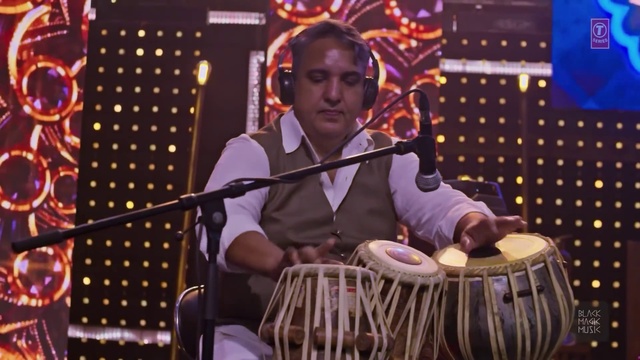 Video Reference: Tabla, Membranophone, Microphone, Musical instrument, Idiophone, Drum, Musician, Lighting, Purple, Music artist