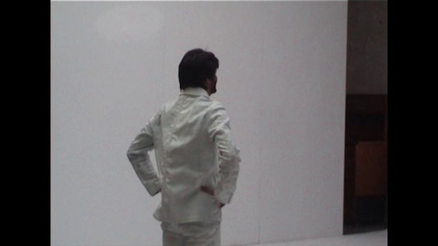 Video Reference: Dress shirt, Sleeve, Gesture, Grey, Art, Event, Presentation, Visual arts, T-shirt, Room