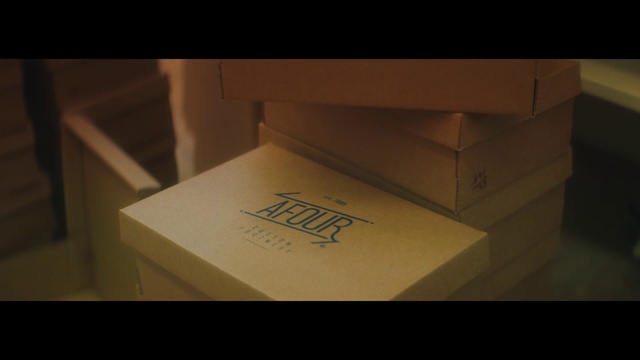 Video Reference: Shipping box, Automotive design, Wood, Carton, Packaging and labeling, Cloud, Eyewear, Font, Tints and shades, Rectangle