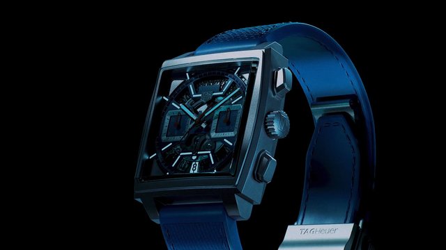 Video Reference: wristwatch, luxury, product shot, blue strap, chronograph, timepiece, close-up, isolated, black background, metal case, watch dial, fashion accessory