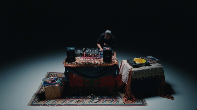 Video Reference: Table, Grey, Rectangle, Tablecloth, Event, Font, Audio equipment, Linens, Art, Performing arts