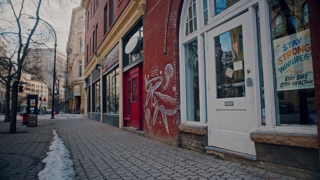 Video Reference: Window, Building, Infrastructure, Road surface, Neighbourhood, Wall, Brick, Sidewalk, Street light, Sky