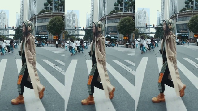 Video Reference: Trousers, Building, Infrastructure, Road surface, Zebra crossing, Street fashion, Skyscraper, Standing, Asphalt, Sky