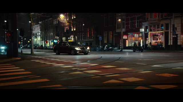 Video Reference: Car, Vehicle, Wheel, Automotive lighting, Tire, Road surface, Street light, Building, Asphalt, Mode of transport