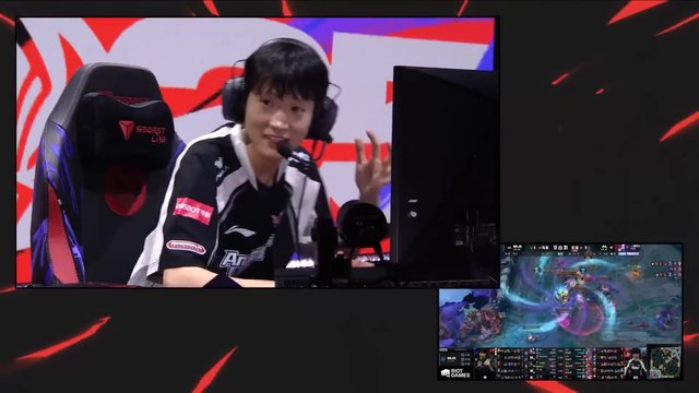 Video Reference: esports, gamer, headset, microphone, gaming chair, monitor, streaming, competitive gaming, video game, stage background, commentary, league match, broadcast, player, inset screen