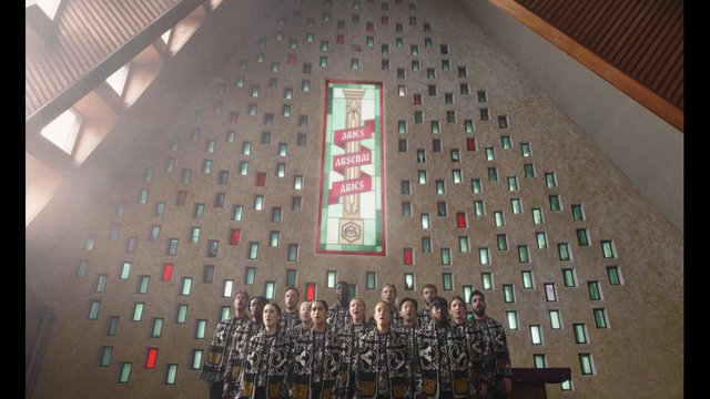 Video Reference: choir, singing, indoor, church, stained glass, robes, group, performance, religious, architecture, wall art, worship, congregation, interior