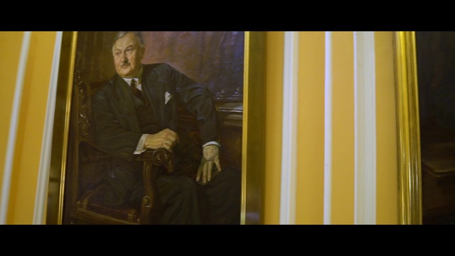 Video Reference: Blazer, Tints and shades, Tie, Formal wear, Art, Rectangle, Event, Visual arts, Suit, Darkness