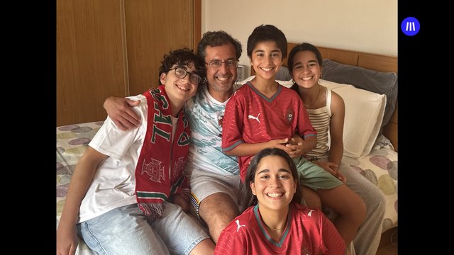 Video Reference: family, group portrait, bedroom, bed, smiling, casual, selfie, indoors, parents, children, portrait, home, togetherness, portrait photography