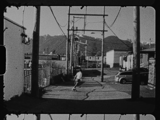 Video Reference: Building, Fence, Black-and-white, Wire fencing, House, Tire, Sky, Electricity, Tints and shades, Window