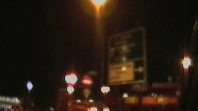 Video Reference: Automotive lighting, Building, Sky, Tints and shades, Electricity, Midnight, City, Event, Darkness, Road